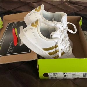 White and gold Adidas sneakers